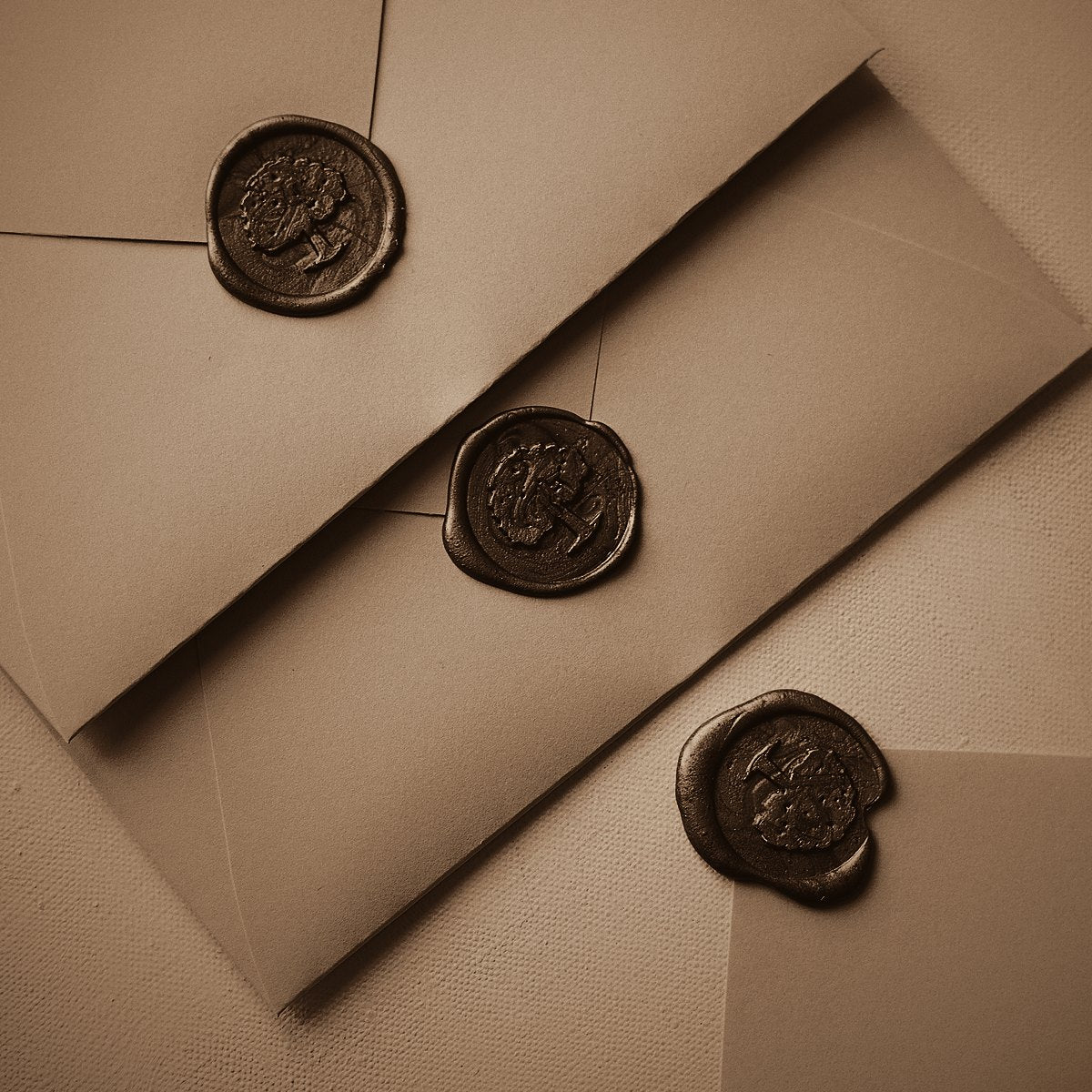 Envelopes sealed with wax seals